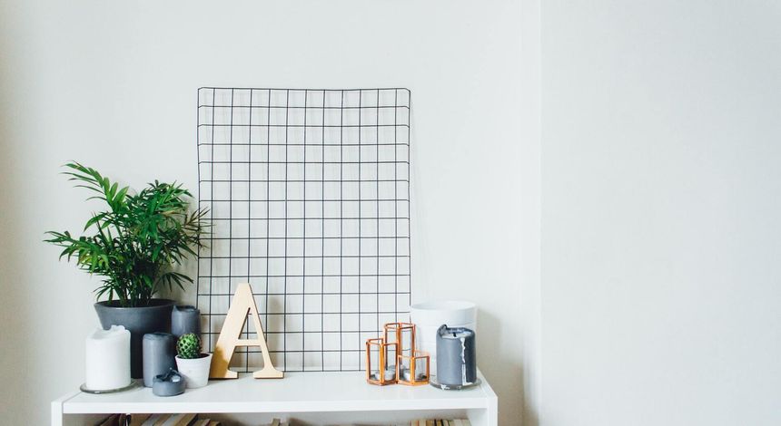 Potted plants, candles on a table